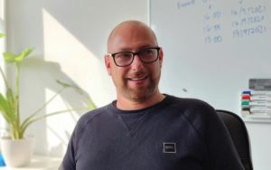 Photo of Fireco's CEO James Wheeler, smiling sitting in an office.